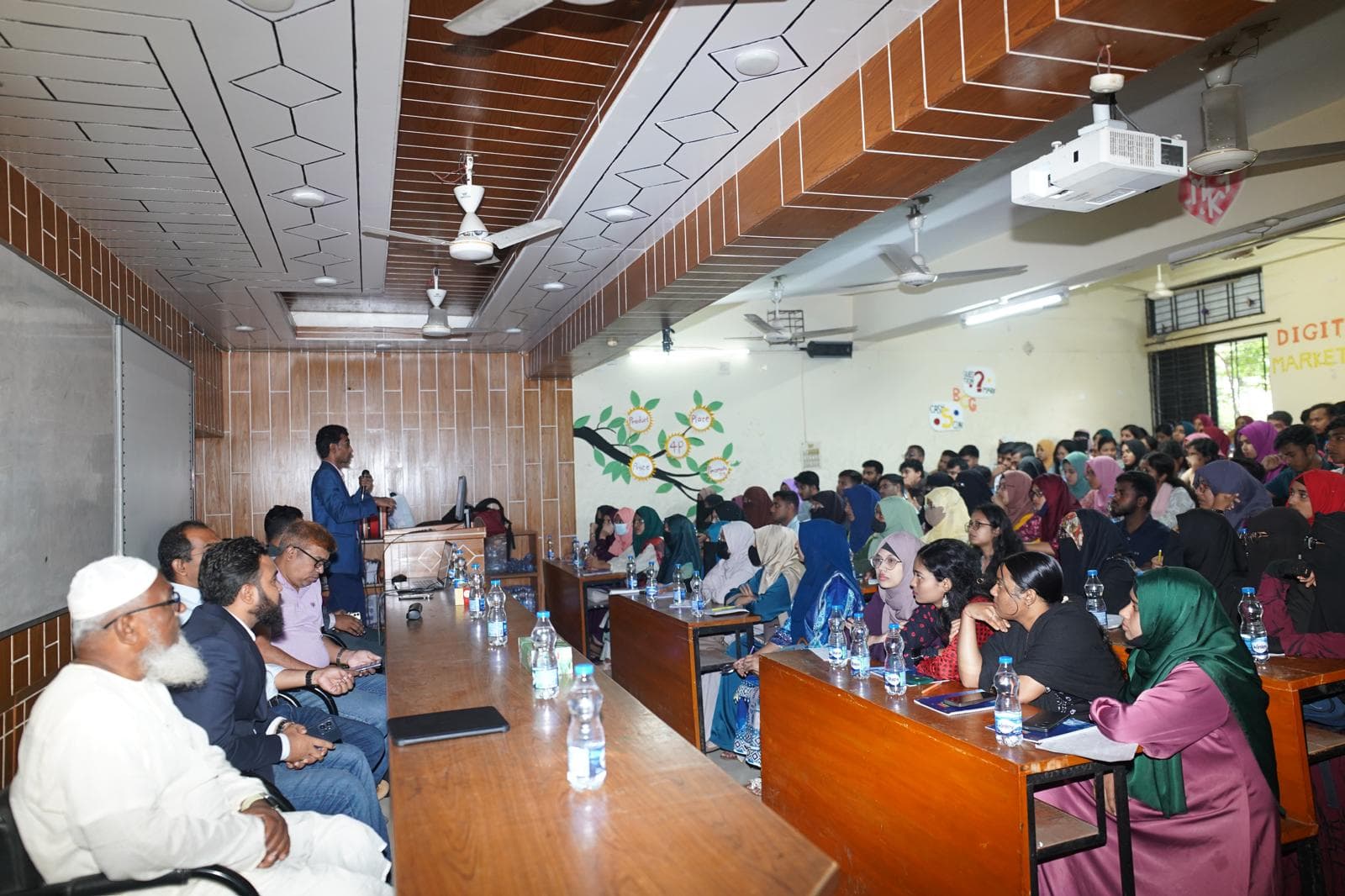 Group photo of guests, teachers, KRTC team, and students at the Rangpur seminar